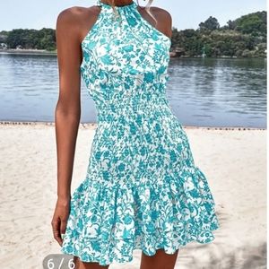 NWOT BEAUTIFUL BLUE & white, wraps around ,crosses on back/ties form fitting top